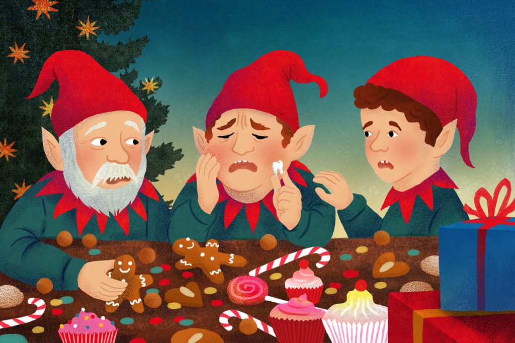 Drei Weihnachtselfen an einem Tisch voller Süßigkeiten. Der mittlere Elf hat offensichtlich Zahnschmerzen und hält einen ausgefallenen Zahn in der Hand, während die anderen beiden ihn besorgt ansehen.